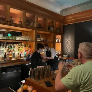 a man and a woman at a bar