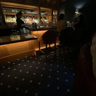 people sitting at the bar