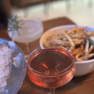 ROSEMARY SPICED MARGARITA (Back) and shoestring fries. I forgot the name of the drink in the front.