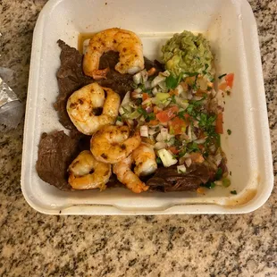 a meal in a styrofoam container