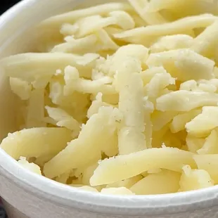 a bowl of shredded cheese