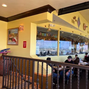 people sitting at tables in a restaurant
