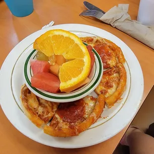 Kids pizza with a side of fresh fruit