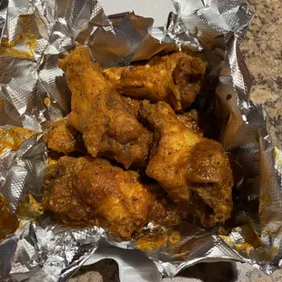 chicken wings wrapped in foil
