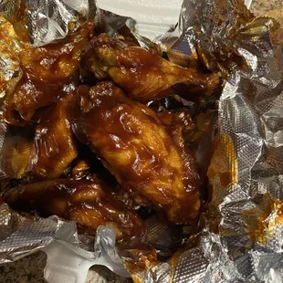 chicken wings wrapped in foil