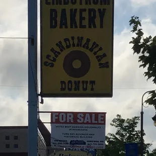 a donut for sale sign