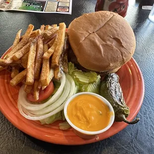 a burger and fries on a plate