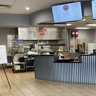 Front counter. They do have dine-in with servers.