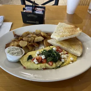 Greek omelette, home fries, and Syrian toast with a side of tzatziki. Yum.