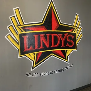 the logo on the wall