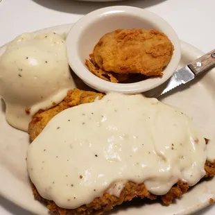 country fried steak with mashed potatoes and fried green tomatoes
