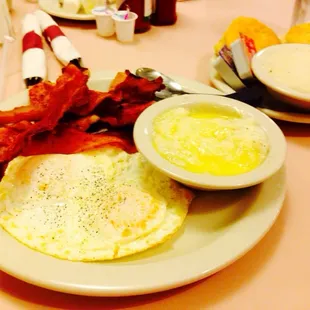 2 eggs over medium, grits, bacon, ham, biscuits and gravy.