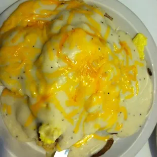The Smothered Platter! Open faced biscuits with sausage, hash browns, scrambled eggs topped with gravy and cheese!!!