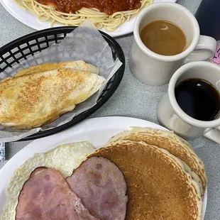 a plate of food and a cup of coffee