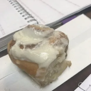 a cinnamon roll with icing