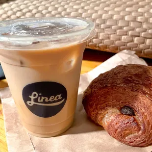 Iced Latte with oatmilk and crispy on the outside, buttery and soft on the inside chocolate croissant