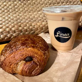 Iced Latte with Oatmilk and chocolate croissant! The croissant was definitely fresh!