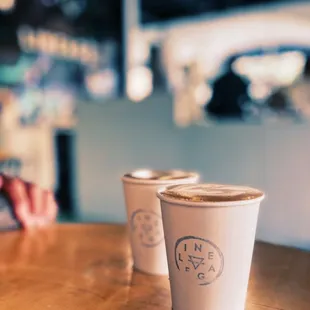 three cups of coffee on a table