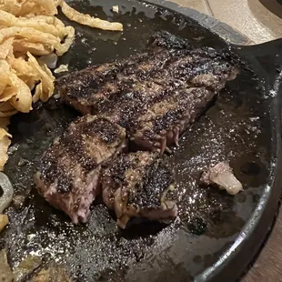 Speciality seasoned ribeye with onion strips.