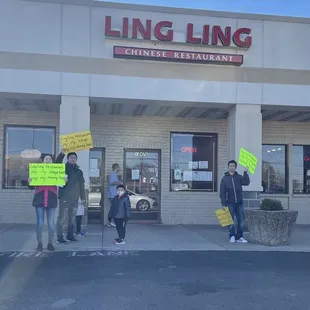 a group of people holding signs