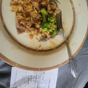 a plate of rice and broccoli