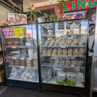 Glass case with fried chicken skins, chicharon, peanuts, hopia
