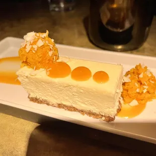 CARROT HALWA  Dahi Cheesecake, Spiced Graham Cracker, Citrus-Carrot Coulis &amp; Toasted Coconut