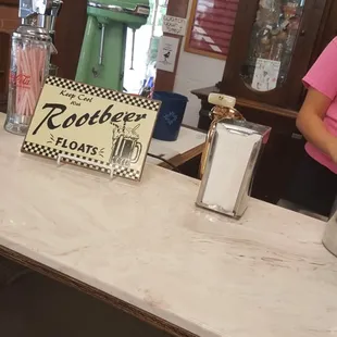 a woman standing at a counter