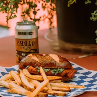 Chicken Schnitzel Sandwich with Arugula and Lemon Mayo, try it with a side of fries and Marble Brewing&apos;s Cholo Stout!