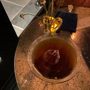 a glass of tea on a table