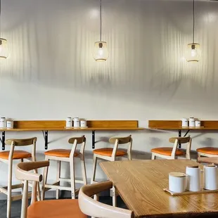 a row of tables and chairs in a restaurant