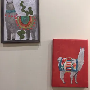 llamas and cactuses on a wall