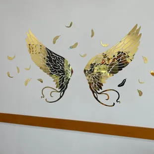 a pair of golden wings