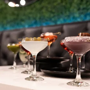 a variety of cocktails on a table