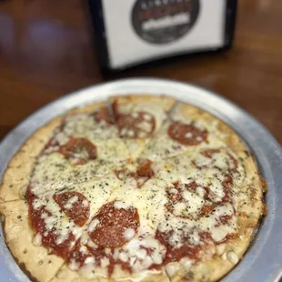 Cauliflower pepperoni pizza