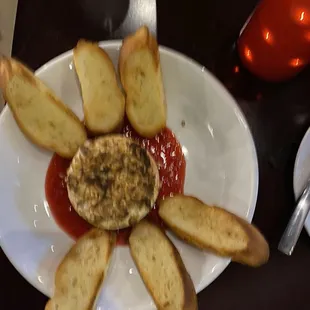 Brie as an appetizer. Warm with raspberry. Delicious