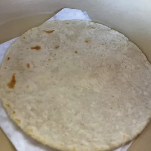 a tortilla in a paper towel