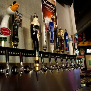 a row of beer taps