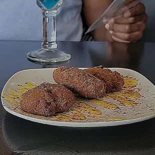 a plate of donuts and a drink