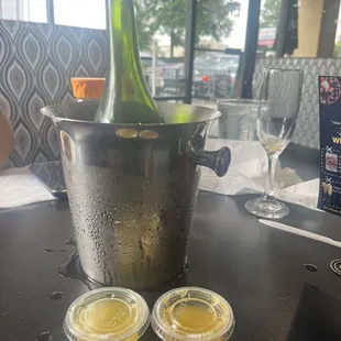 Bottle of champagne with juice in ramicans