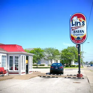 a car parked in front of a restaurant