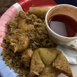 Shrimp fried rice crab Rangoon, spring roll and sweet and sour sauce. The best dinner ever.