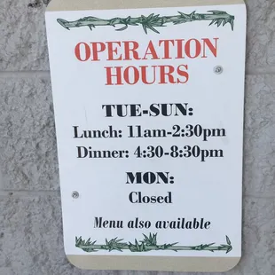 a sign for operation hours