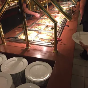 a buffet with plates of food