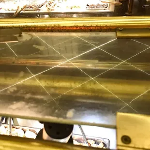 Yes, this is the glass above the food. Sorry, this is not acceptable at all. and it is just overwhelming DIRTY everywhere !