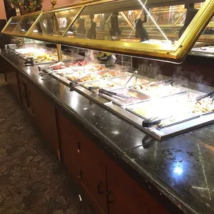 Part of the buffet. Does not look to bad, doesn't it ? BUT WAIT FOR IT !              THIS PLACE SHOULD BE CLOSED FOR BEING THAT DIRTY !!!!!
