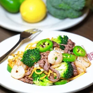 a plate of food with broccoli and shrimp