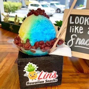 Rainbow shave ice with Azuki beans - regular size.  Tastes sooooo good! Very fine shaven ice.