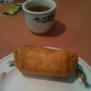 Vegetable egg roll along side some traditional tea. Yummm