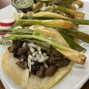 a taco with meat and onions